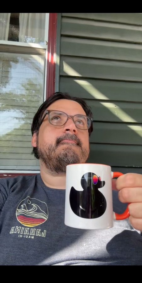 Bryan holding the Find Your Aloha Duck Mug